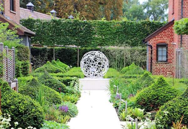 Yew topiary and garden sculpture in luxury boutique garden suites