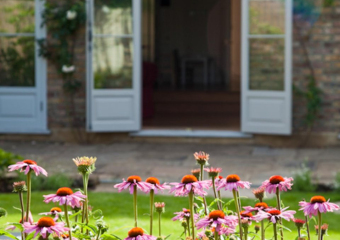 Patio to a bright colourful garden designed by Ann- Marie Powell, July , UK 2009